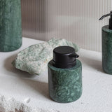 MARBLE low dispenser in dark forest, Mette Ditmer